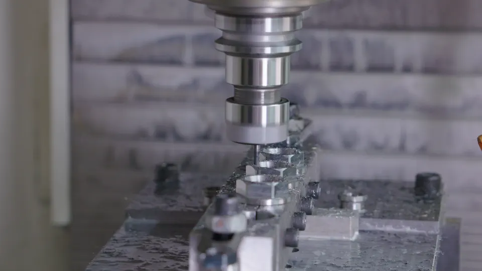 Close-up of an end mill cutting a fixtured metal component