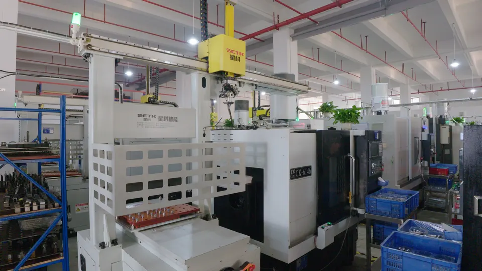 Large enclosed gantry-style machining equipment in a CNC workshop